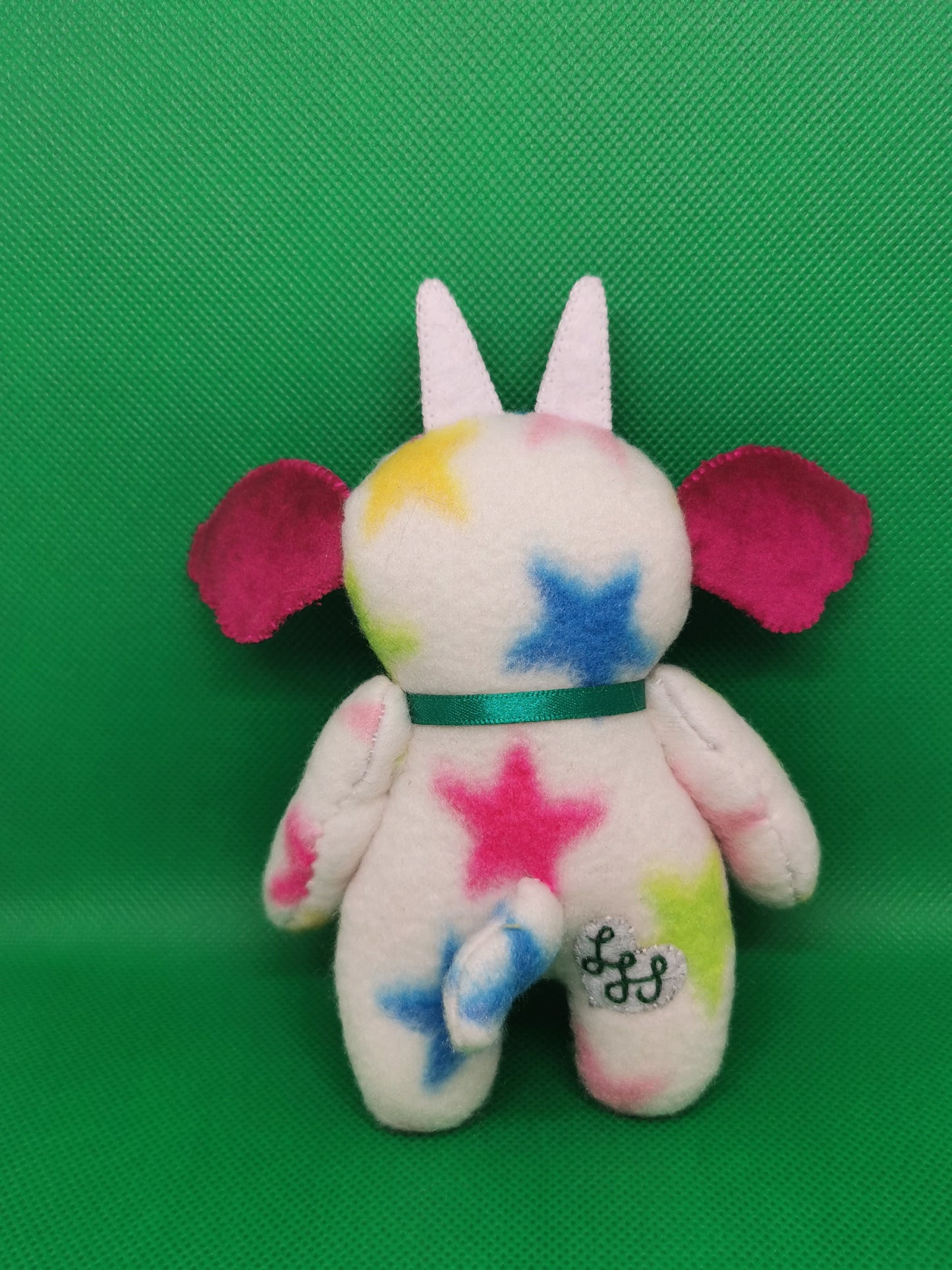 Handmade pocket Goblin plushie in white star print